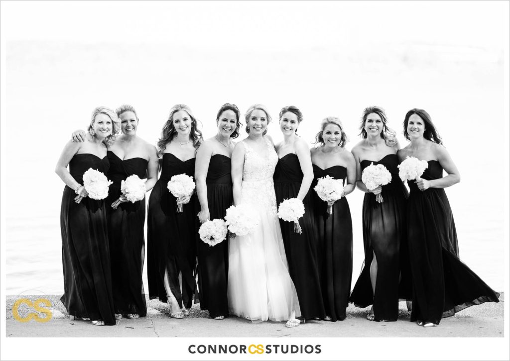 wedding portraits with bride and wedding party and bridesmaids on sunny day in old town Alexandria, Virginia photography by Connor Studios 