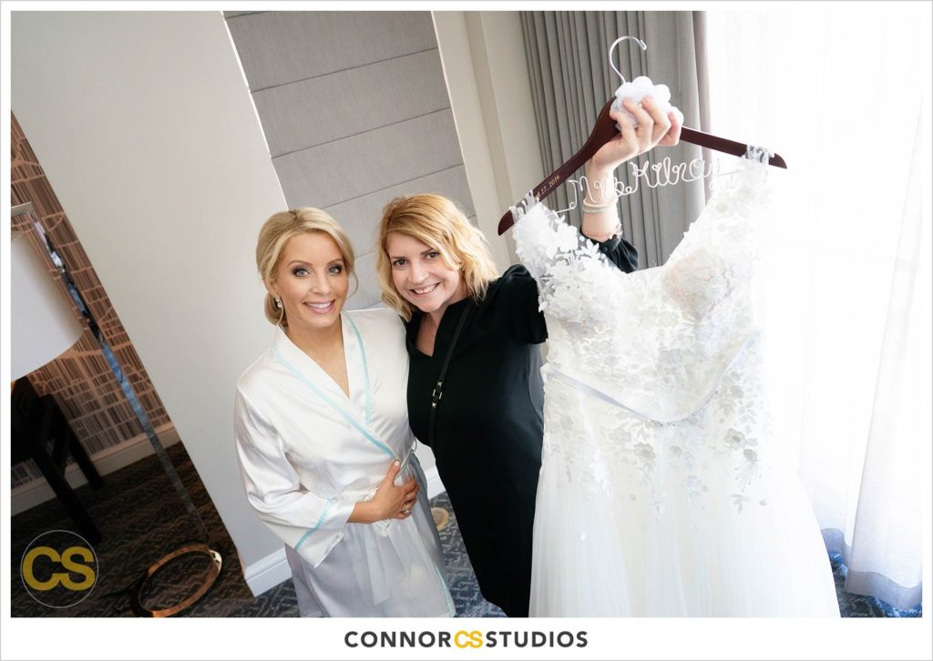 bride and wedding planner Amanda Mccabe from Beacon and Berkeley events with wedding dress at Fairmont Hotel in Washington, DC photography by Connor Studios 