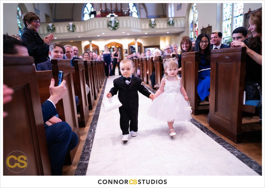 flower girl and ring bearer walking down the aisle at The Basilica of St. Mary Church in old town Alexandria, Virginia photography by Connor Studios 