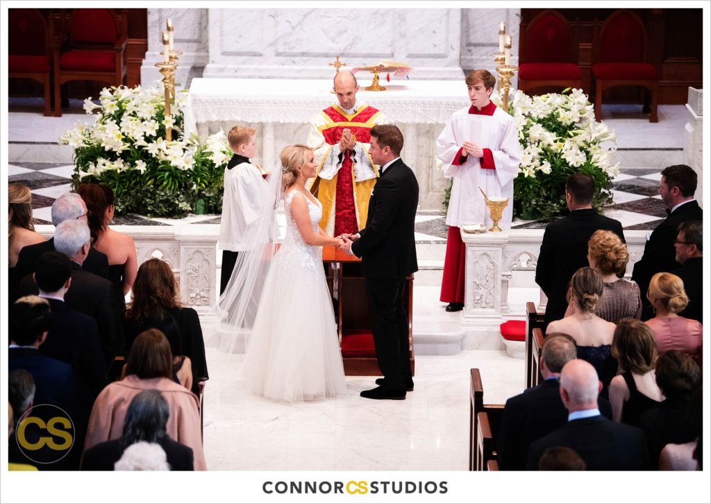 wedding with bride and groom at The Basilica of St. Mary Church in old town Alexandria, Virginia photography by Connor Studios 