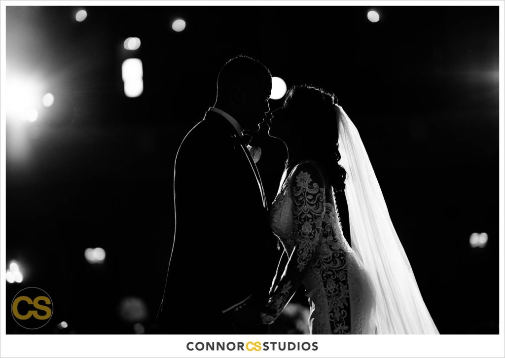 black and white silhouette photograph of bride and groom from the stage at the Mellon Auditorium in Washington, DC by Connor Studios
