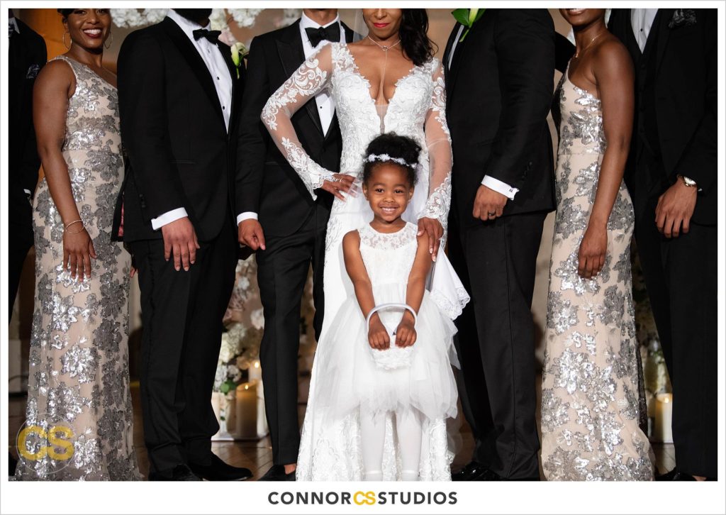 photograph of cute flower girl and bride at a luxury wedding at the Mellon Auditorium in Washington, DC by Connor Studios