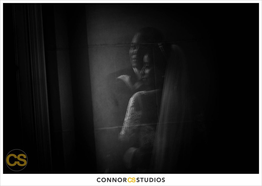 black and white silhouette photograph of bride and groom in a reflection at the Mellon Auditorium in Washington, DC by Connor Studios