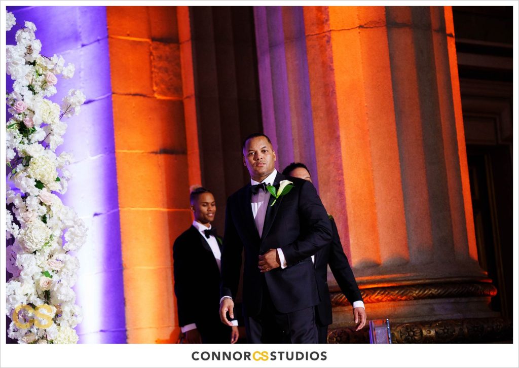 groom entering wedding at the Andrew W. Mellon Auditorium in Washington, DC by Connor Studios