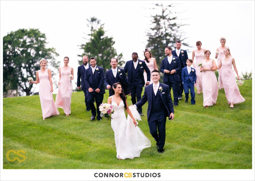 happy bride and groom portraits with wedding party in the country at a wedding at wyndridge farm photography by connor studios