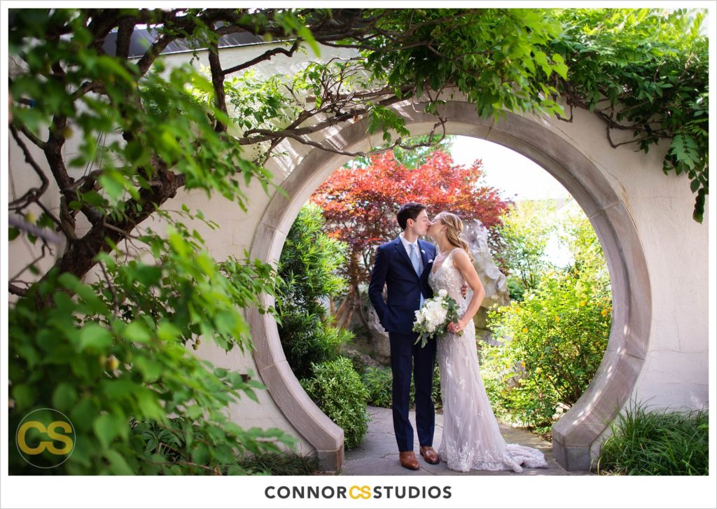 photograph of bride and groom on their wedding day for portraits at the bonsai gardens at the national arboretum in washington, dc by connor studios