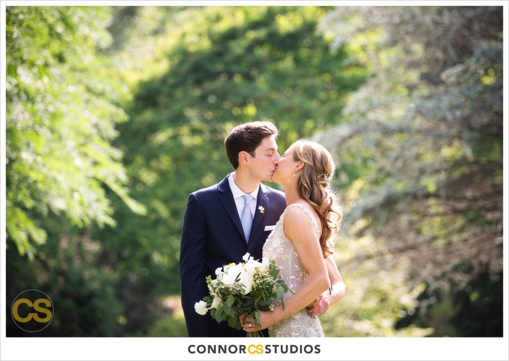 photograph of bride and groom on their wedding day for portraits in the herb garden at the national arboretum in washington, dc by connor studios