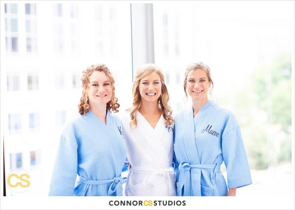 bride and bridesmaids in cute blue robes at the conrad washington dc hotel by connor studios