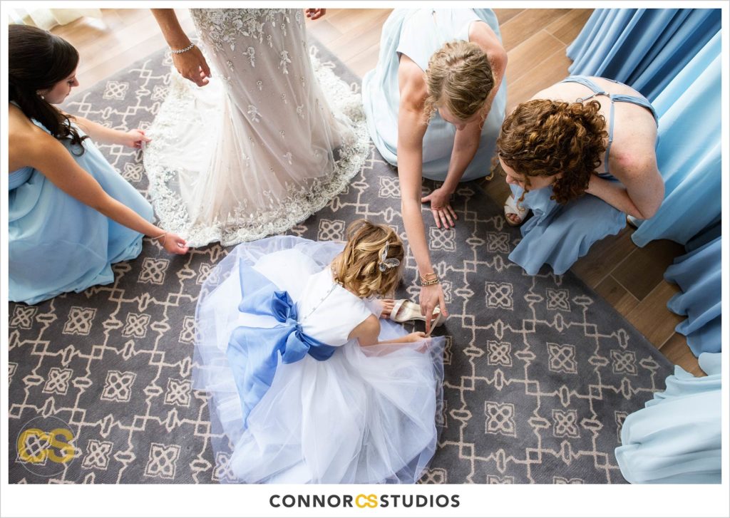 bride and bridesmaids and flower girl in light blue dresses at the conrad washington dc hotel by connor studios