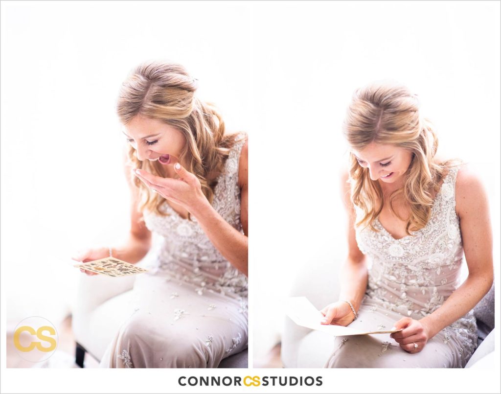 bride reading letter from groom and laughing and crying at the conrad washington dc hotel by connor studios