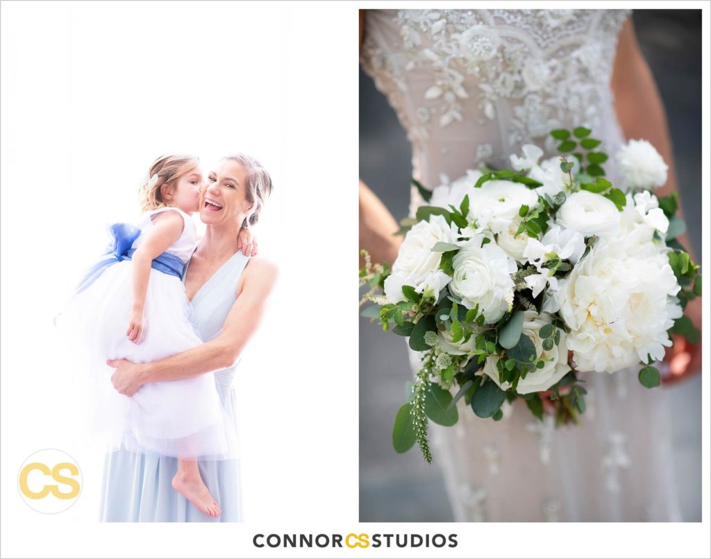 bridesmaid in light blue dress being kissed by flower girl and bride's bouquet by Floral and Bloom at the conrad washington dc hotel by connor studios