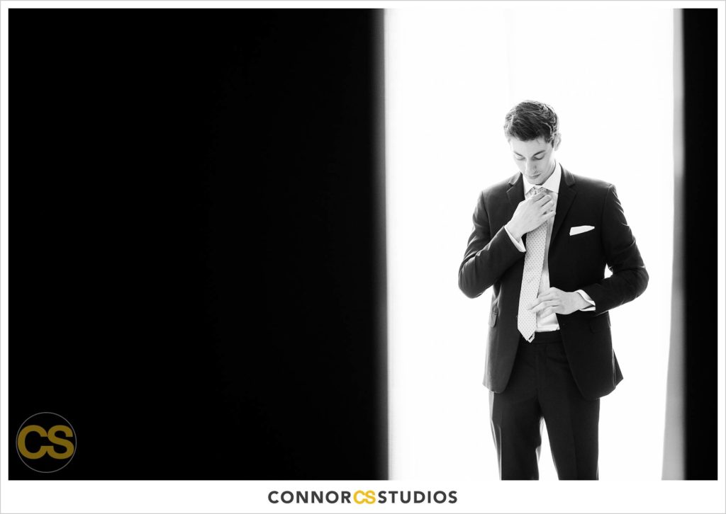 groom getting dressed at the conrad washington dc hotel by connor studios