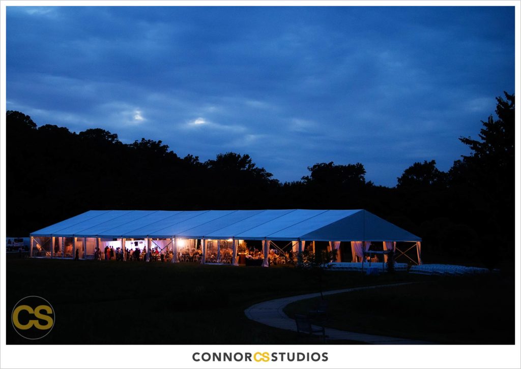 detail of large tented outdoor summer wedding reception at night at the national arboretum in washington, dc by connor studios