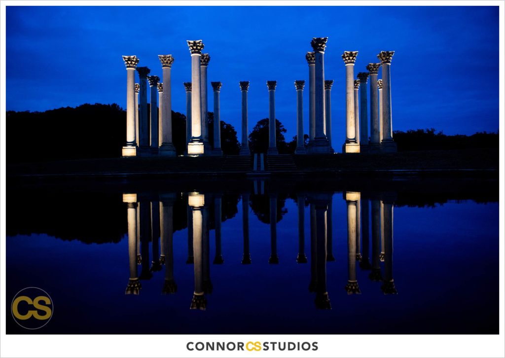 detail of National Capitol Columns lit up at night at large tented outdoor summer wedding reception at the national arboretum in washington, dc by connor studios