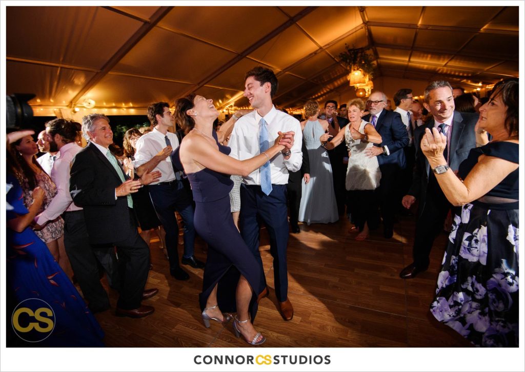 dancing at large tented outdoor summer wedding reception at the national arboretum in washington, dc by connor studios