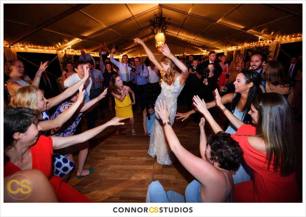dancing at large tented outdoor summer wedding reception at the national arboretum in washington, dc by connor studios