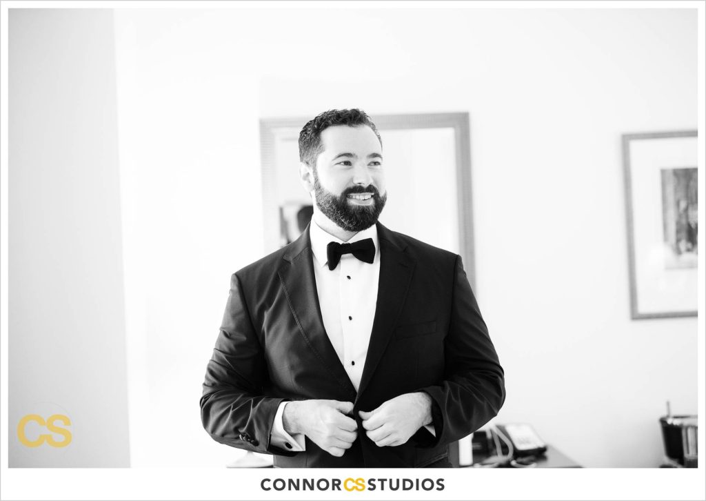 groom getting dressed in tuxedo at the Cosmos Club in Washington, DC by Connor Studios