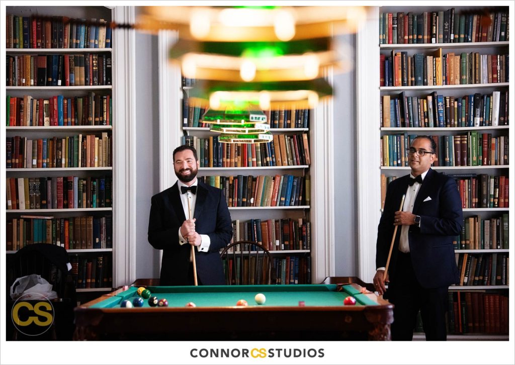 groom and groomsman playing pool at the Cosmos Club in Washington, DC by Connor Studios
