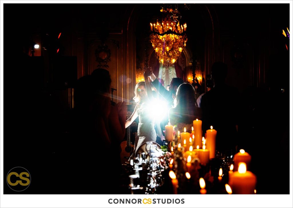 bride and groom first dance with candles at a luxury wedding in the ballroom at the Cosmos Club in washington, dc by connor studios