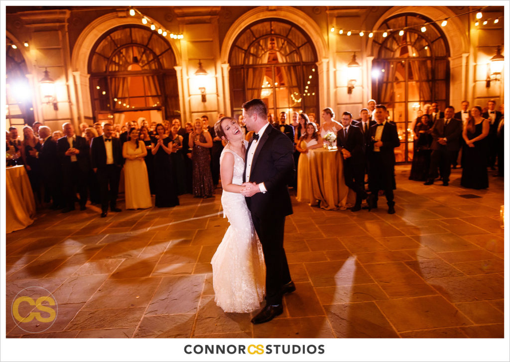 bride and groom's first dance on the astor terrace at night at the st regis hotel in washington, dc by connor studios