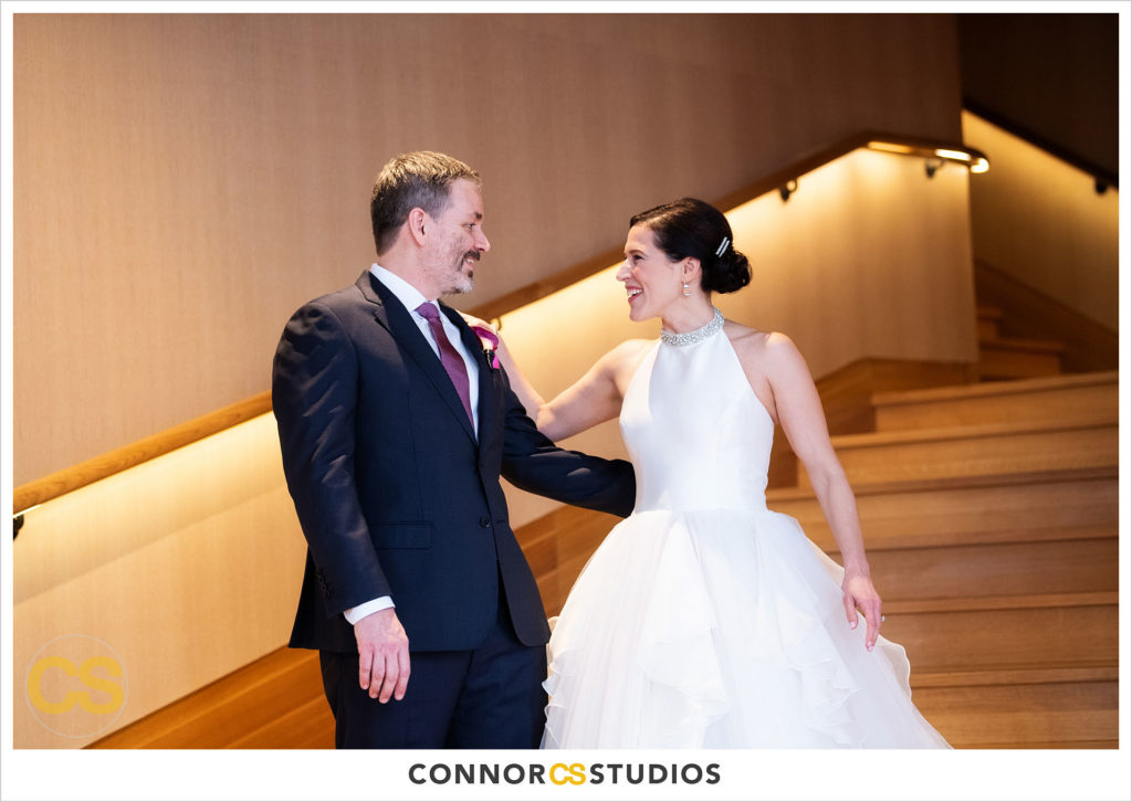 wedding first look with bride and groom on staircase at conrad dc hotel in washington, dc by connor studios