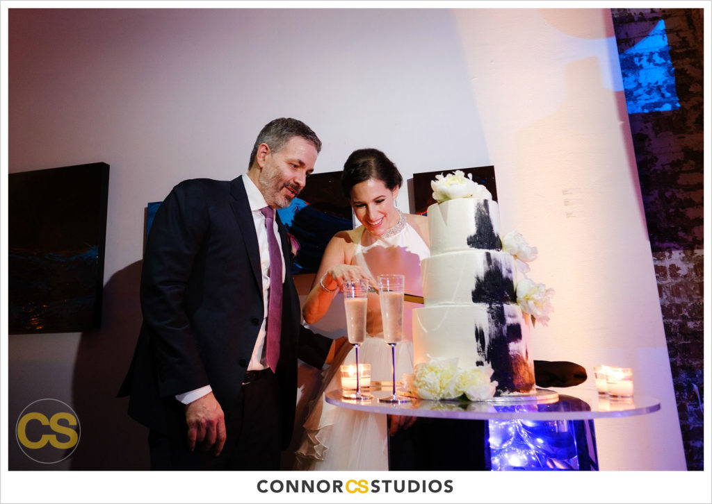 wedding reception buttercream cake cutting at long view gallery with evoke design and creative in washington, dc by connor studios