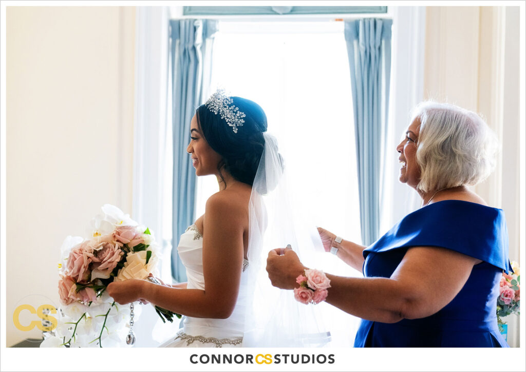luxury wedding photography of bride getting ready at the cosmos club during covid-19 in washington, dc by connor studios