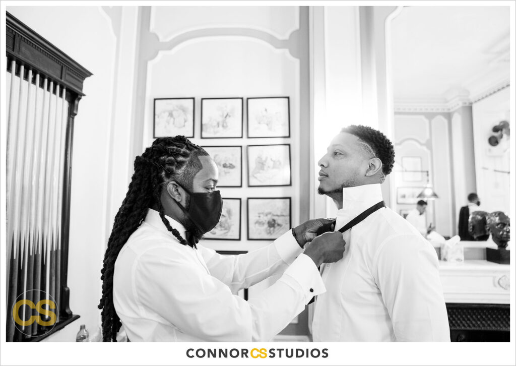 luxury wedding photography of the groom getting ready for his wedding at the cosmos club during covid-19 in washington, dc by connor studios