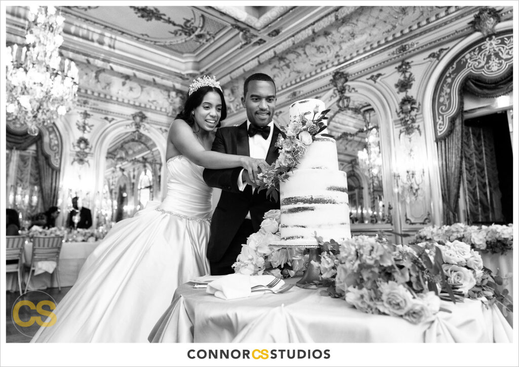 cake cutting at luxury wedding at the cosmos club during covid-19 in washington, dc by connor studios