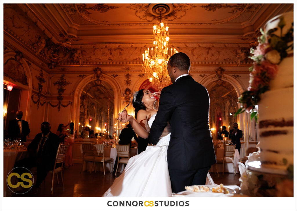 cake cutting at luxury wedding at the cosmos club during covid-19 in washington, dc by connor studios